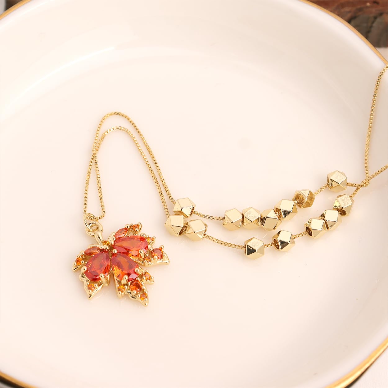 Maple Leaf Necklace detail showing delicate leaf and crystal pendant
