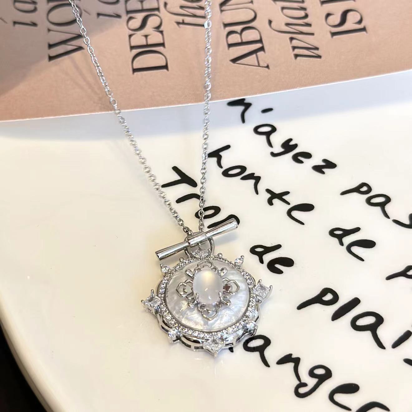 Detailed view of the heart-shaped pendant of Glittering Heart Necklace