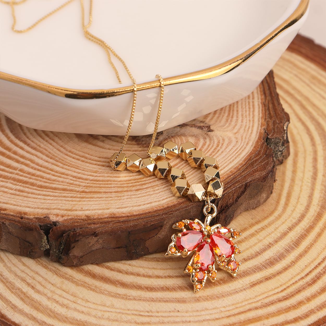 Maple Leaf Necklace detail showing delicate leaf and crystal pendant