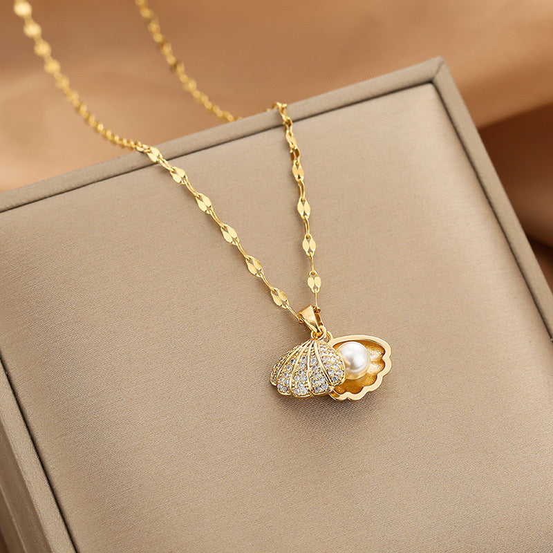 Pearl Shell Necklace showcasing delicate shell pendant with lustrous pearl accent