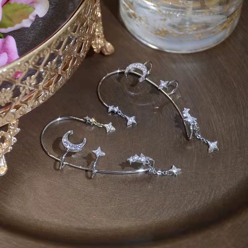 Silver Star and Moon Earrings featuring star and moon accents