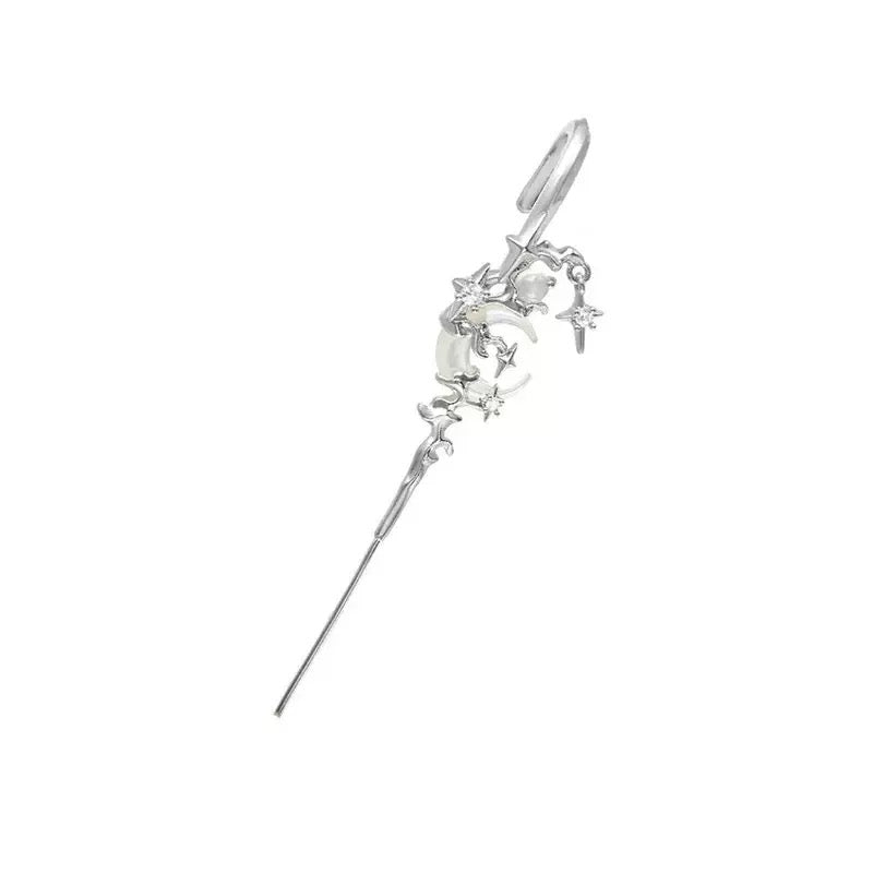 Close-up of celestial seashell detail on earrings