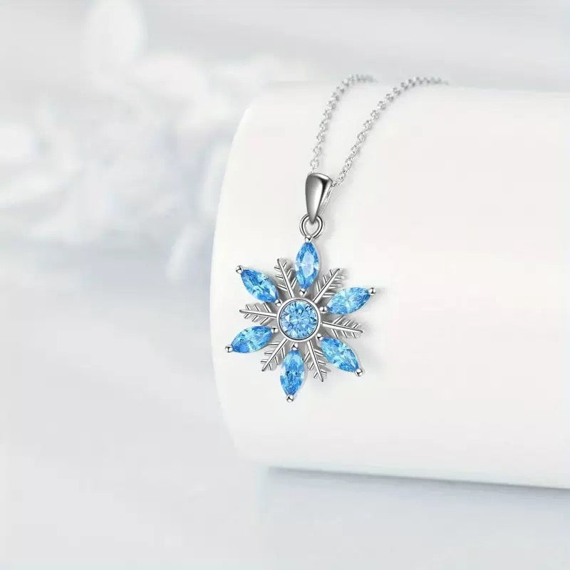 Model wearing Snowflake Pendant Necklace, side view highlighting design