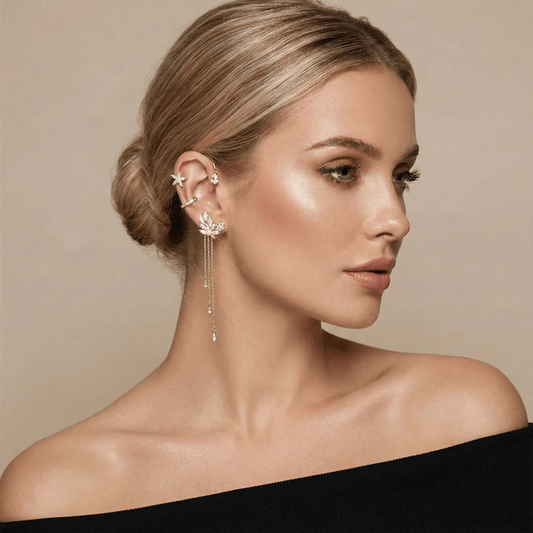 Model wearing gold butterfly ear cuff