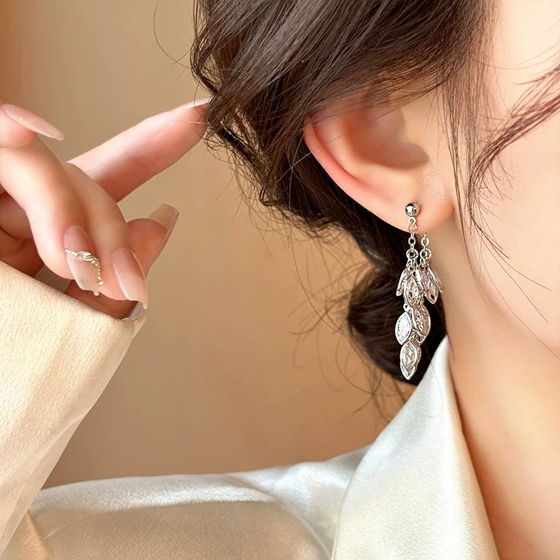 Close-up of Silver Teardrop Earrings highlighting sterling silver material and hook closure
