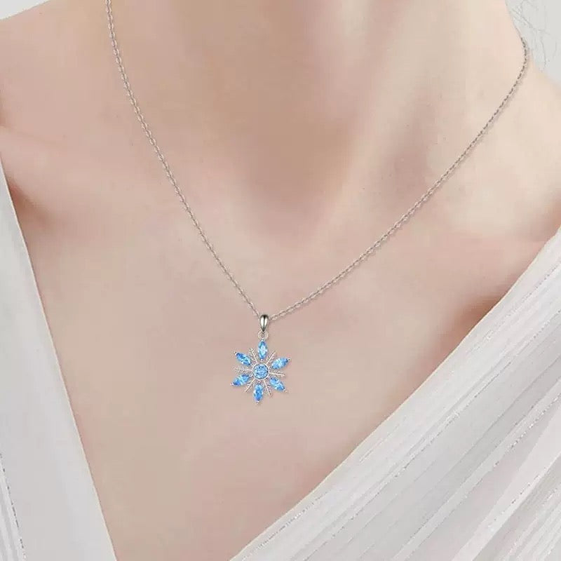 Lifestyle image featuring Snowflake Pendant Necklace with elegant winter outfit