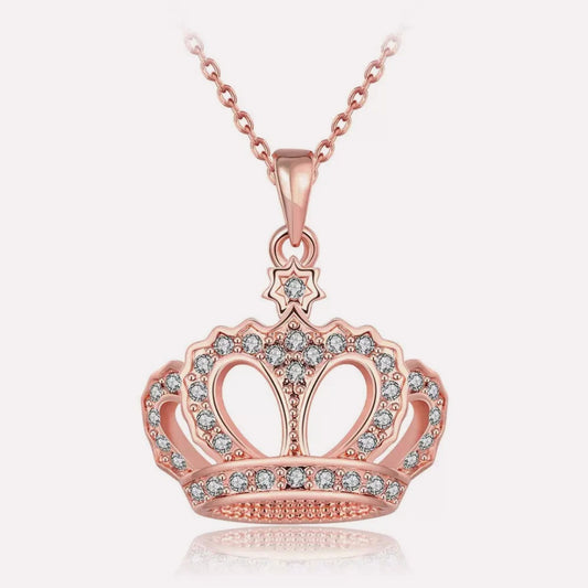 Rose gold plated crown pendant necklace featuring sparkling cubic zirconia