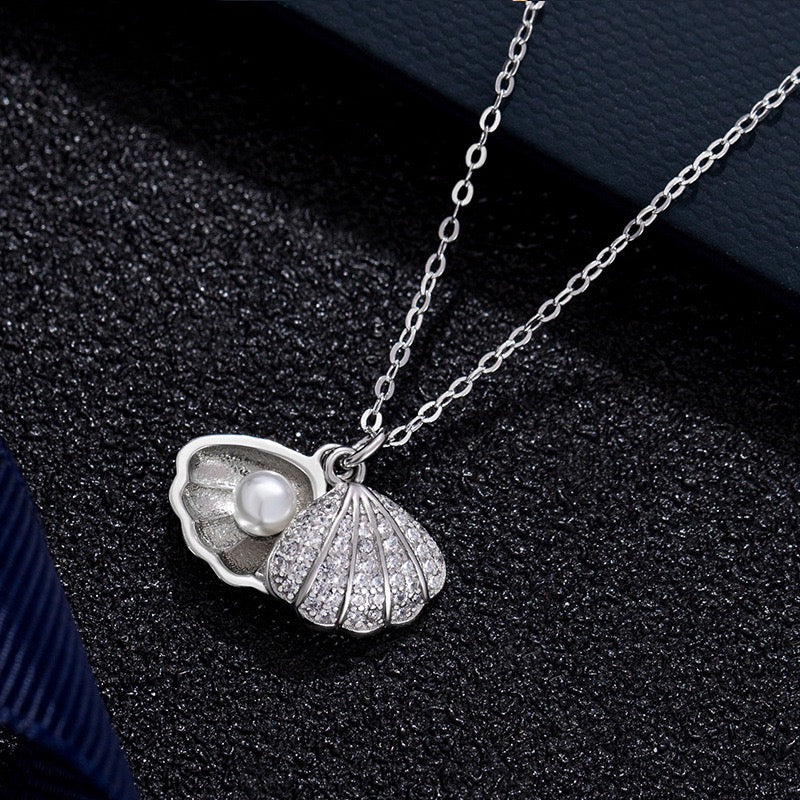 Silver Pearl Shell Necklace featuring adjustable chain and lobster claw clasp