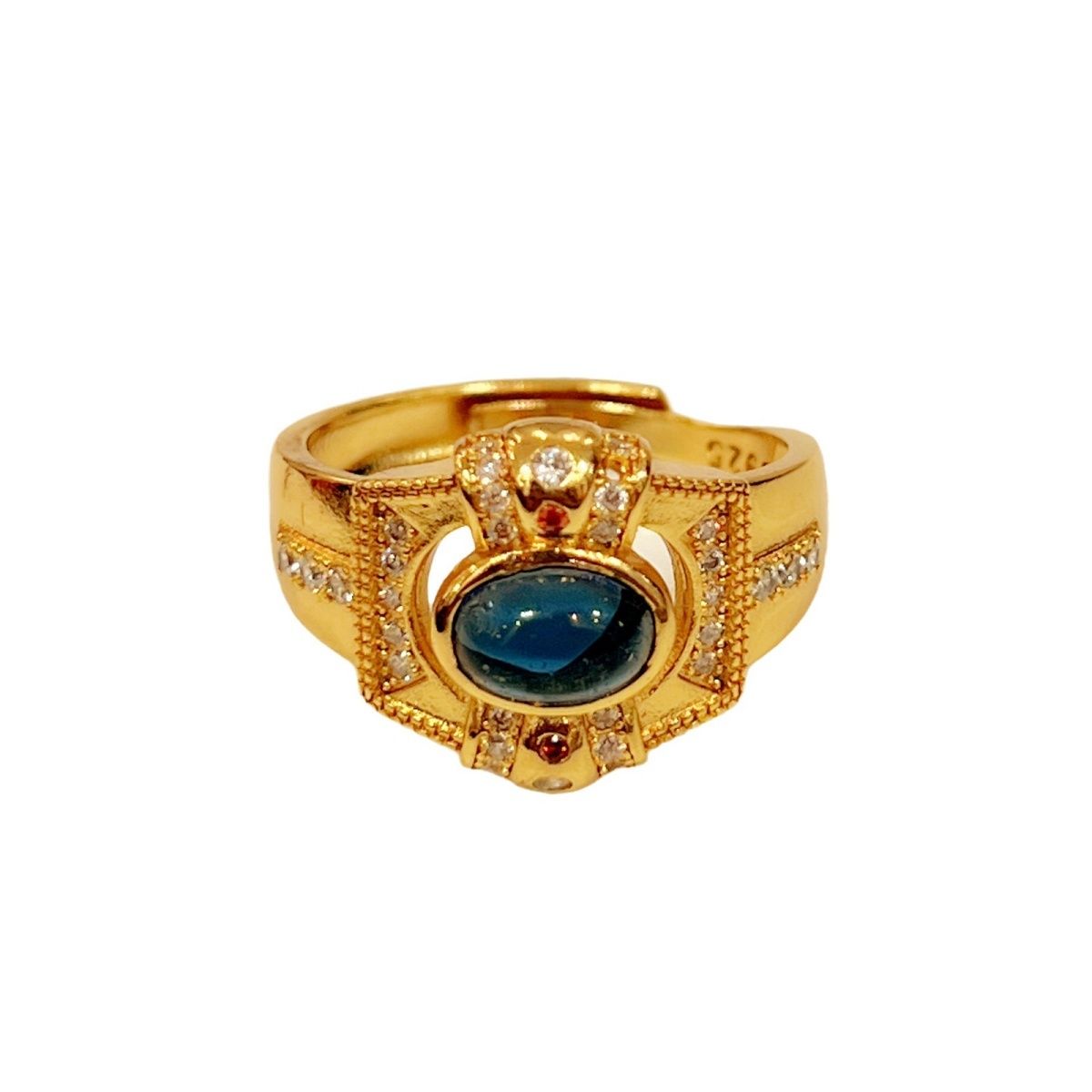 Queen's Dream Ring with central blue gemstone and rhinestone accents