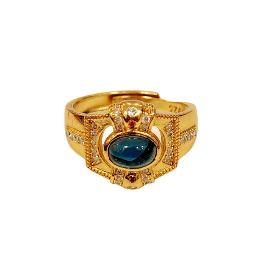 Queen's Dream Ring with central blue gemstone and rhinestone accents
