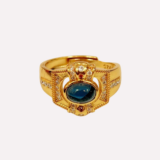 Queen's Dream Ring with central blue gemstone and rhinestone accents