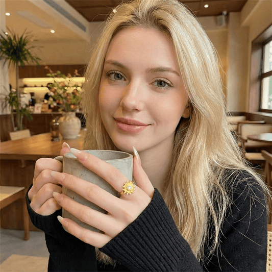 Model wearing Solar Flare Ring showcasing the radiant sun motif and adjustable open band