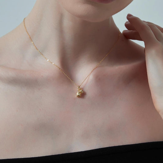 Model wearing Lily of the Valley Necklace with silver plating