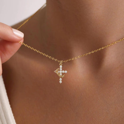 Close-up of 14K Gold Crown Cross Pendant highlighting intricate craftsmanship