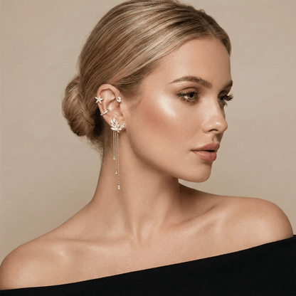 Model wearing gold butterfly ear cuff 