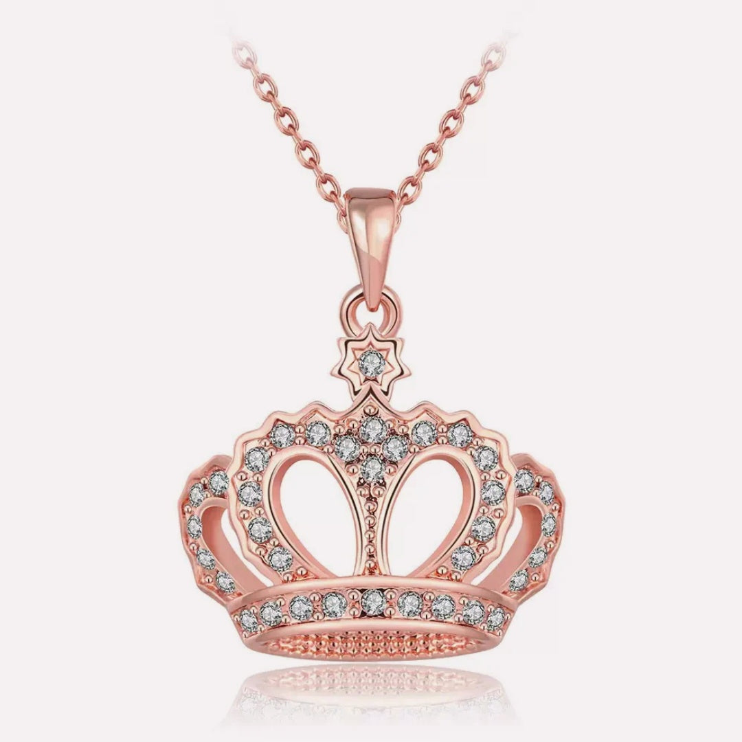 Rose gold plated crown pendant necklace featuring sparkling cubic zirconia