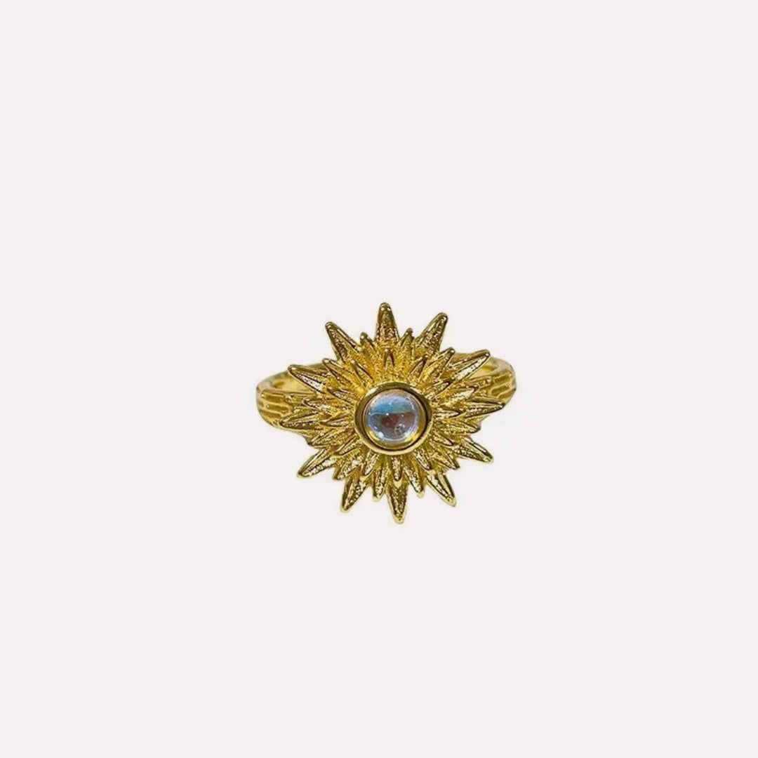 Solar Flare Ring by CotaJewelry with sun-inspired open band design on white background
