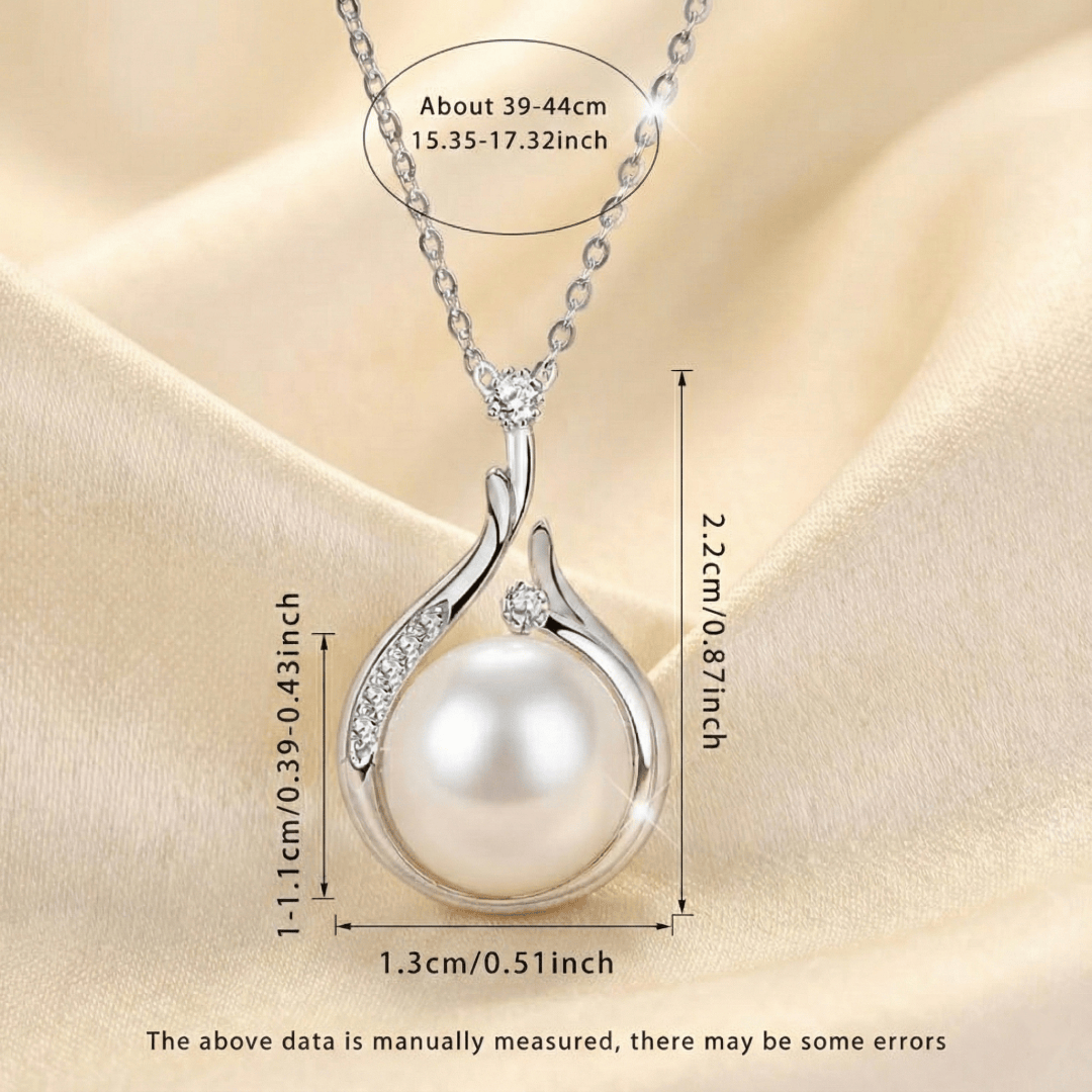 Close-up of teardrop pearl pendant on Pearl Drop Necklace showing polished gold-plated setting