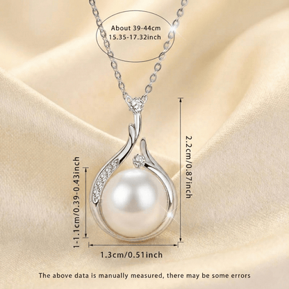 Close-up of teardrop pearl pendant on Pearl Drop Necklace showing polished gold-plated setting