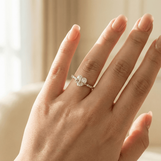 Close-up of model wearing gold Eternal Love Ring by CotaJewelry
