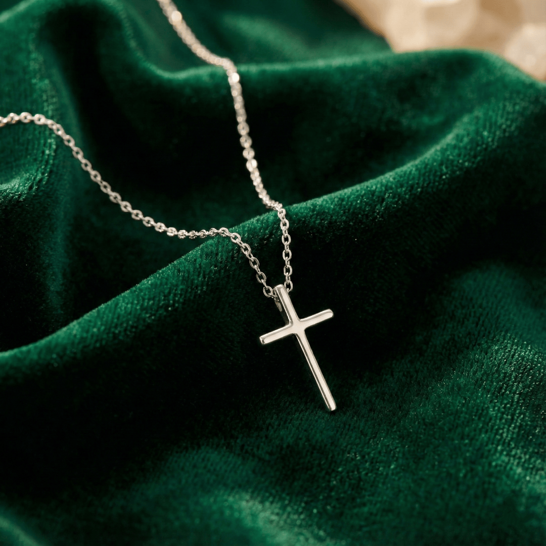 Detail view of adjustable chain and craftsmanship of gold-plated cross necklace