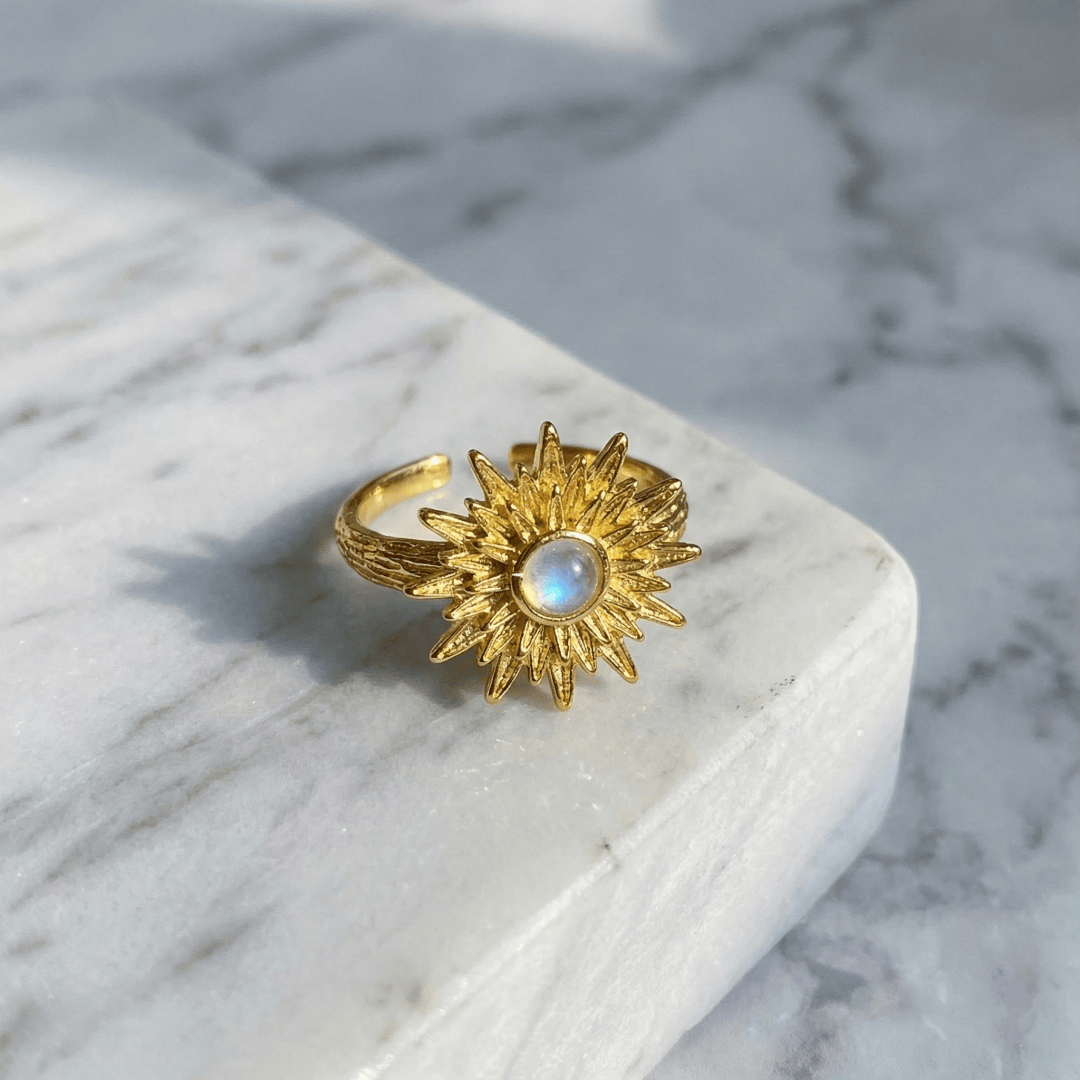 Close-up of Solar Flare Ring highlighting floral sun-inspired details and polished metal finish