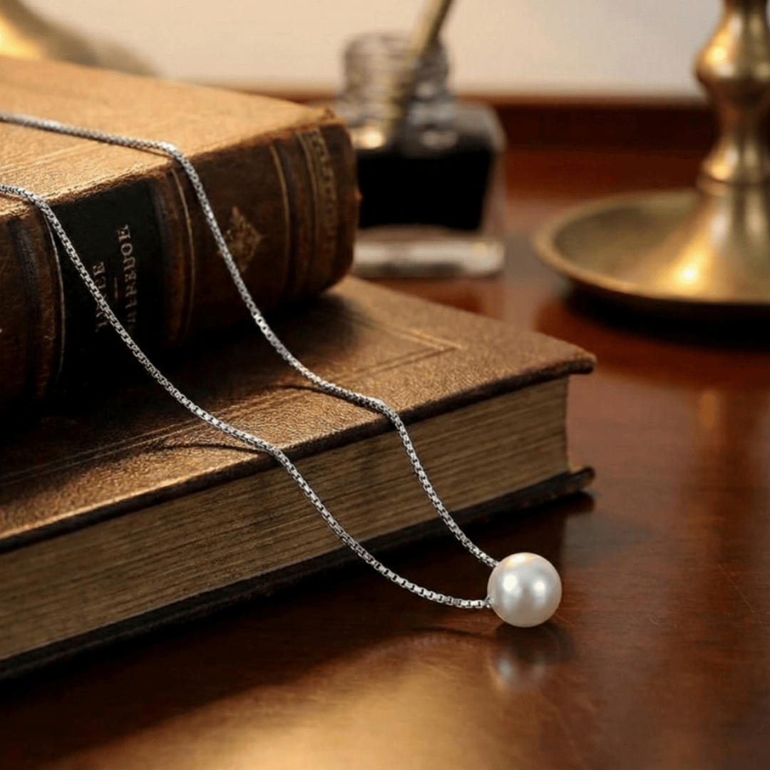 Detail view of Eternal Pearl Necklace craftsmanship with smooth pearl surface and refined finish