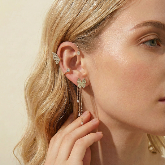 Model wearing Graceful Butterfly Ear Cuffs with tassel design