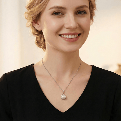 Model wearing Pearl Drop Necklace highlighting the elegant teardrop pearl drop on neckline