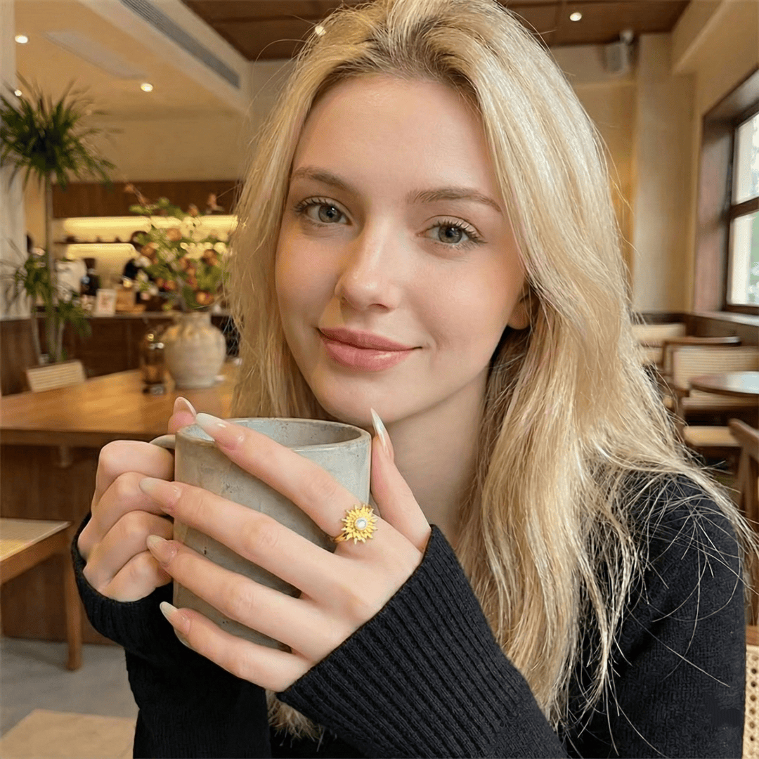 Model wearing Solar Flare Ring showcasing the radiant sun motif and adjustable open band