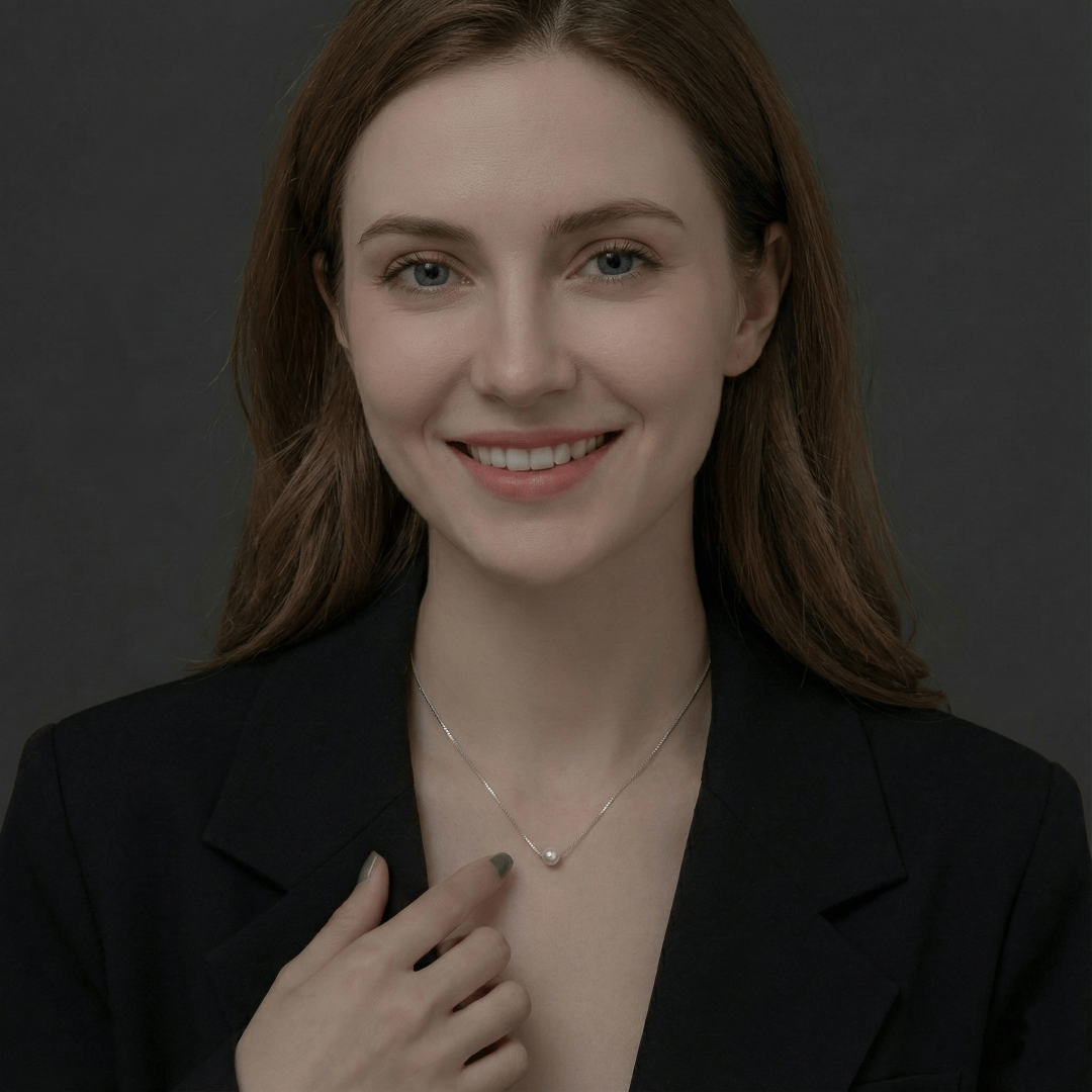 Model wearing Eternal Pearl Necklace highlighting elegant pearls along the neckline
