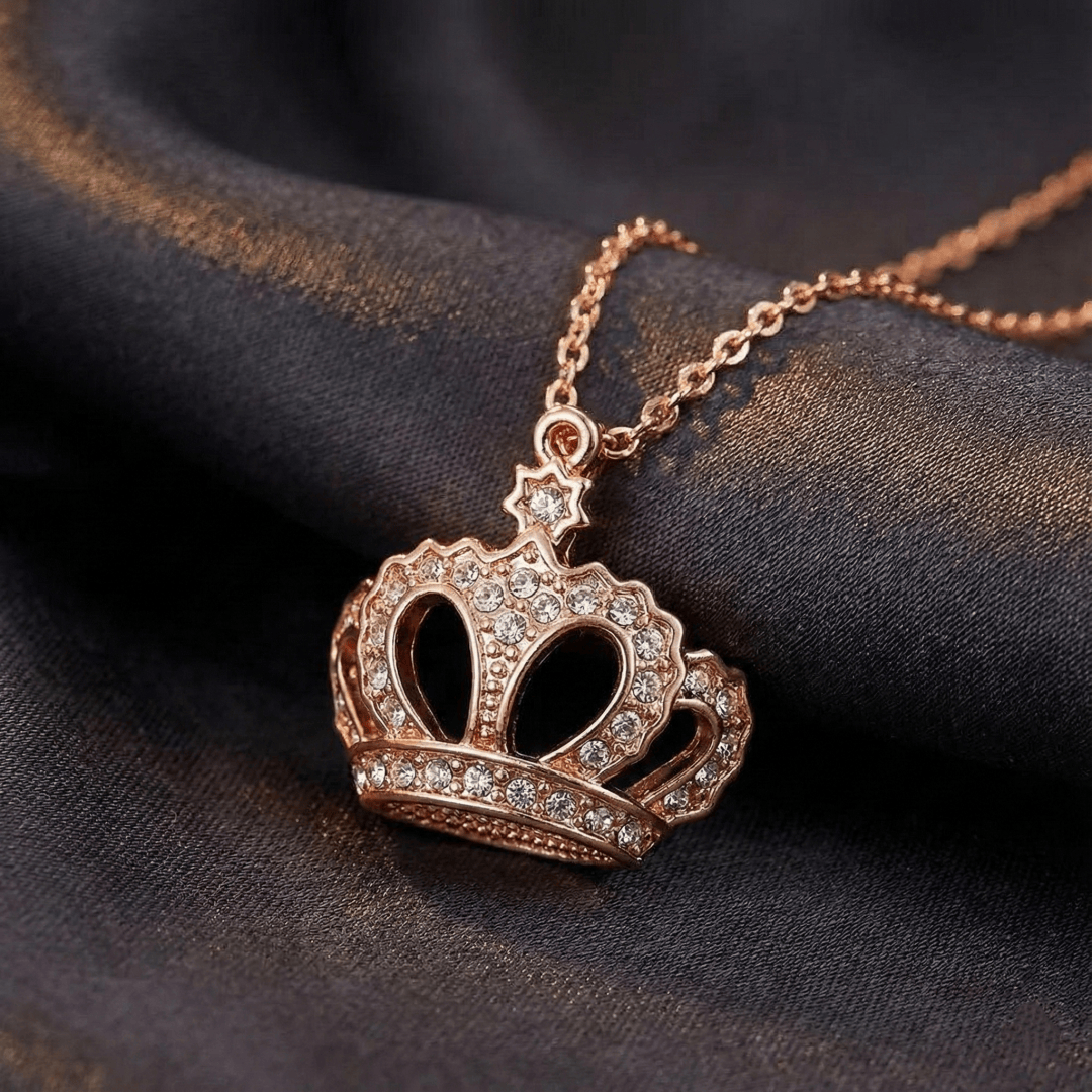 Close-up of crown pendant necklace highlighting cubic zirconia setting and crown craftsmanship