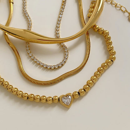 Bracelet chaîne tennis à cœur perlé en acier inoxydable